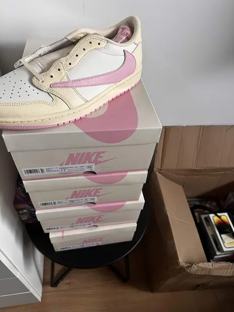 Nike Jordan boxes stacked by a desk