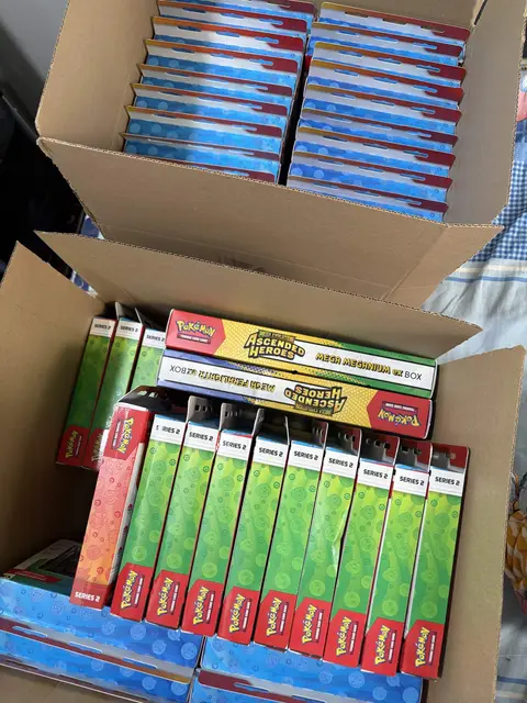 A shipping box full of Pokémon ETBs and Ascended Heroes boxes