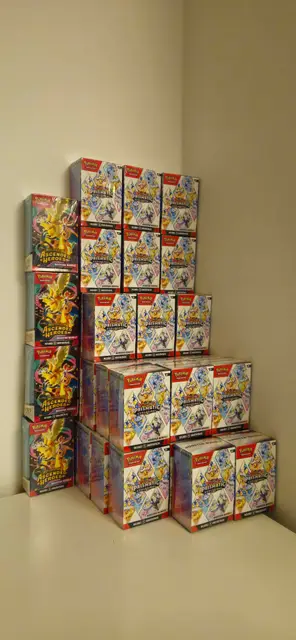 A corner stacked with Pokémon booster boxes